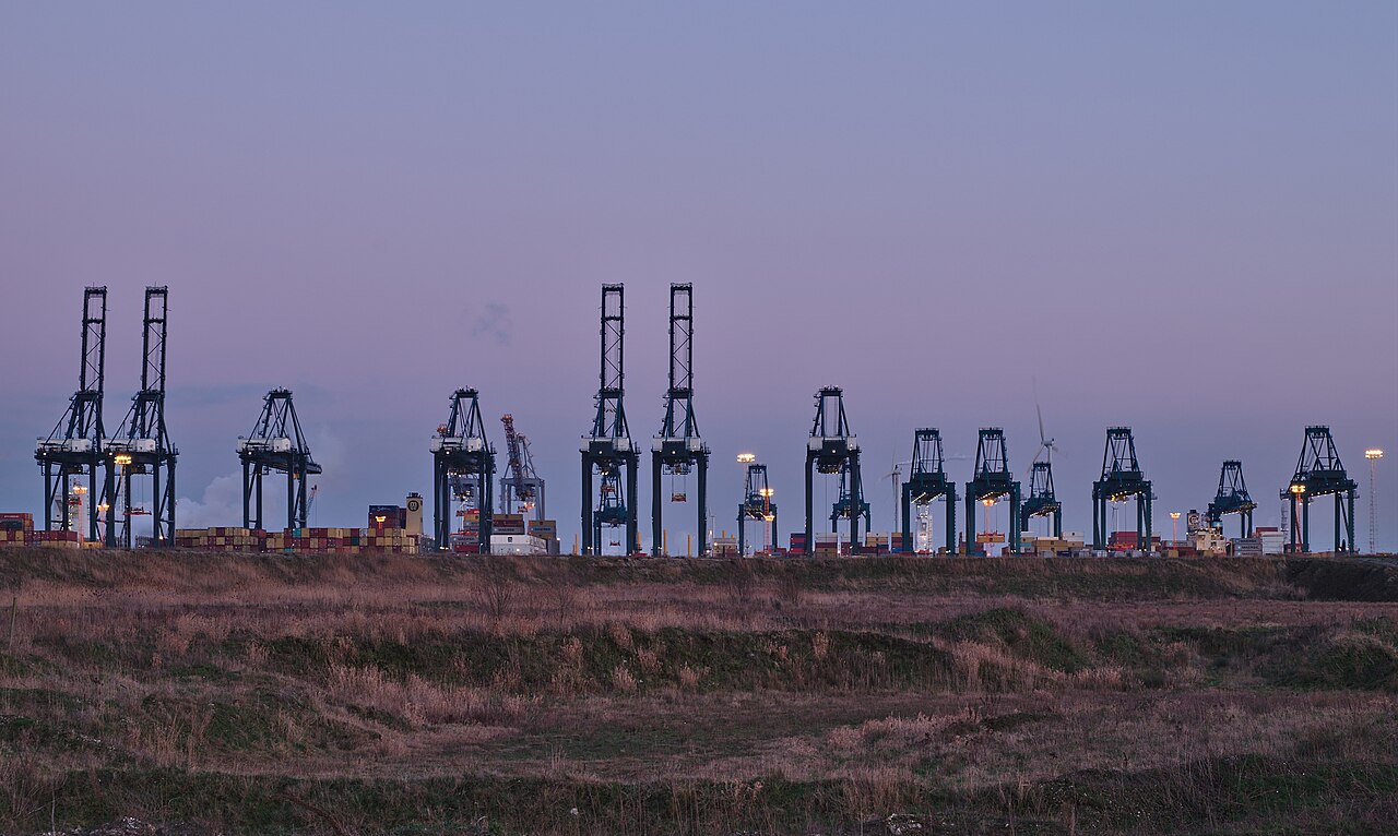 Container cranes at a port terminal at dusk
